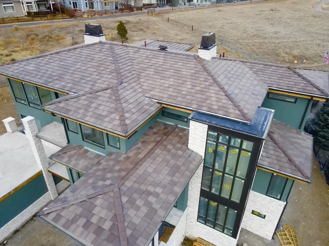 Drone view of a concrete tile roof on a Colorado home